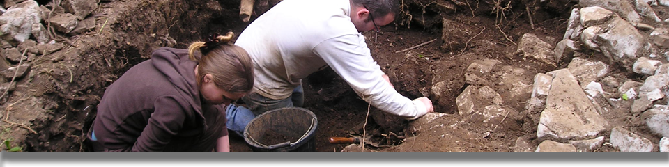 Excavating the runnel west of the wall in Trench 1