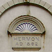 Hermon Chapel, Bridgend, was built in 1861 to a design by the prolific chapel 
    architect the Rev Thomas Thomas of Landore, and incorporates his signature façade featuring a giant arch extending from the ground up into the 
    gable