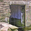 St Cybi's well at Llangybi (Mon) lies a short distance outside the churchyard