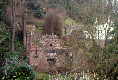 The derelict remains of a stone built mill.