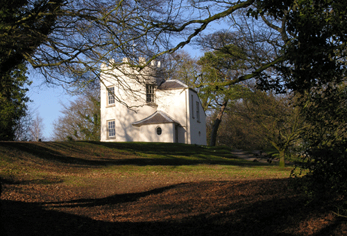 View through the trees looking up to the folly