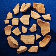 Sherds of locally produced grey cook ware.