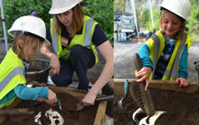 Adults and children enjoying our 'Body in the Box' excavation