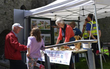 Visitors discovering all about the work the Trust carried out at the castle